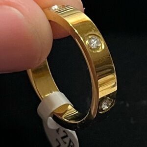 Size 7 gold tone ring band. Unisex. NEW